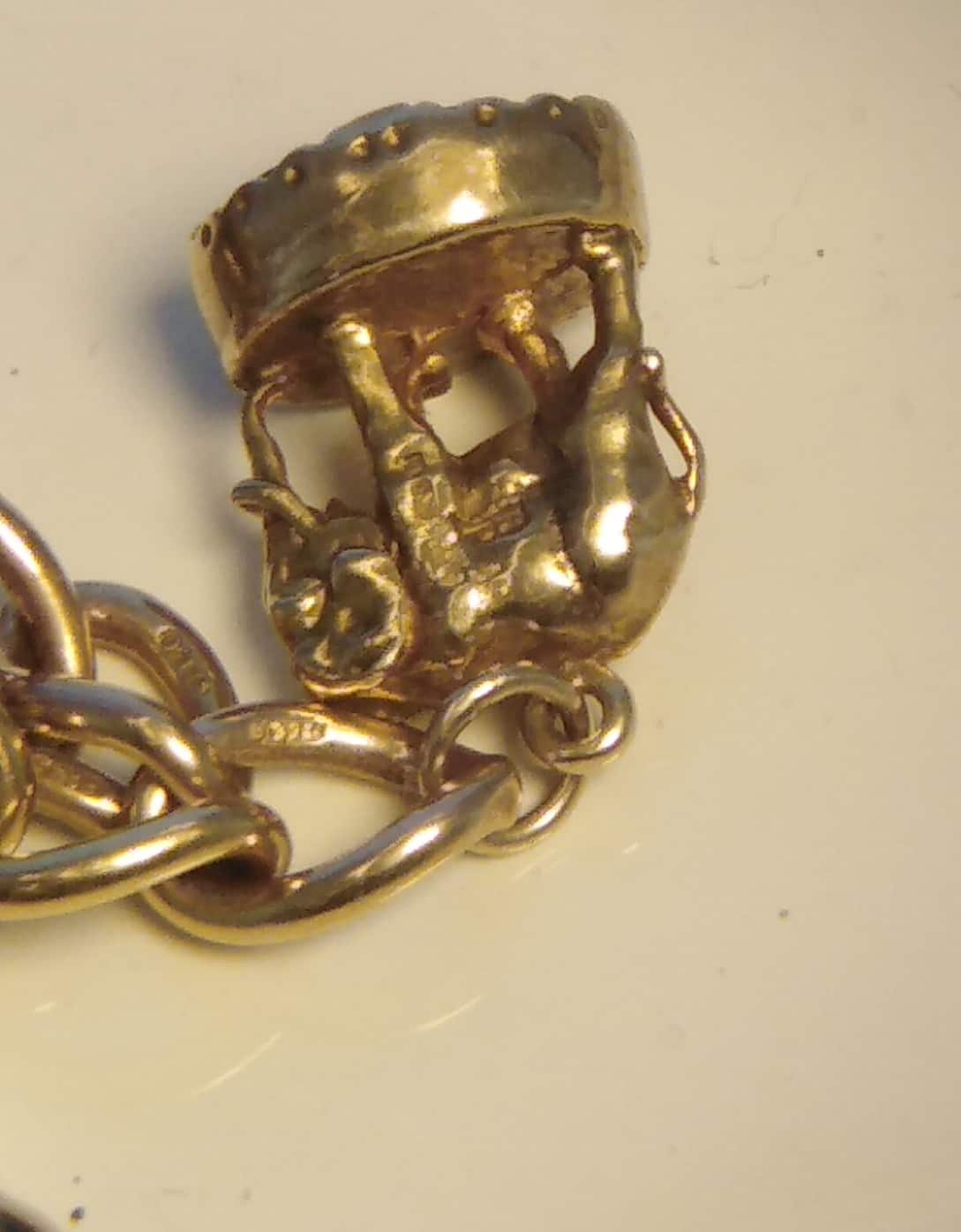 1963 9ct Gold Charm Bracelet and 10 Charms 32.8g